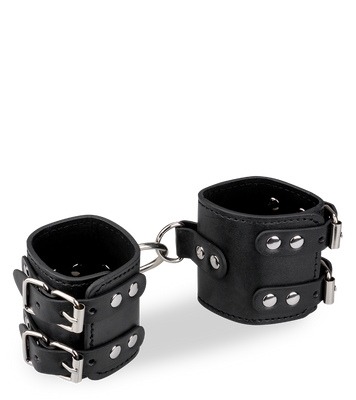 Black leather BDSM handcuffs with straps